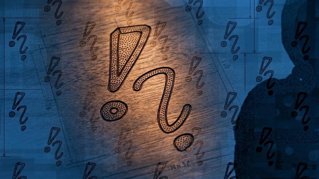 Uitgesneden vraagteken en uitroepteken op een houten ondergrond